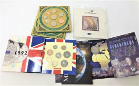 Four coin collection issues - 2000 Millenium £5 coin, 1999 last coins of the twentieth century,