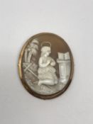 An antique gold framed cameo brooch