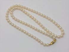 A 20 inch pearl necklace on gold clasp