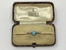 A 15ct gold topaz and diamond brooch, 3.65g.