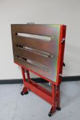 A metal folding work bench