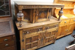 A carved oak buffet back sideboard
