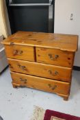 A pine four drawer chest