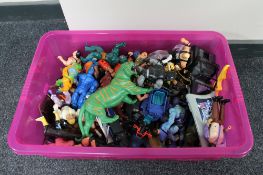 A crate of plastic Action figures and toys