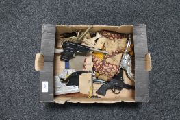 A box of Chad valley and other toy pistols