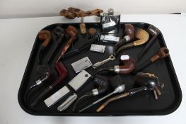 A large collection of pipes and lighters