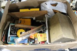 A box of photographic developing items,
