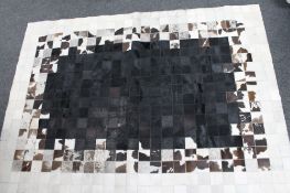 A cow hide carpet 203 cm x 143 cm