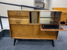 A mid 20th century teak sideboard