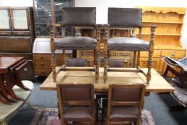 A carved oak refectory style dining room table together with six chairs