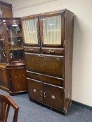 A mid 20th century kitchen cabinet