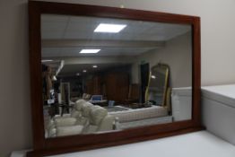 A stained pine overmantel mirror