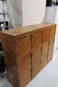 A 20th century school cabinet with 12 compartments