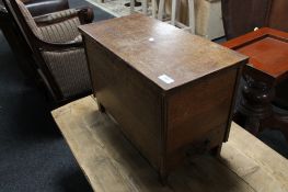 An oak storage box fitted a drawer