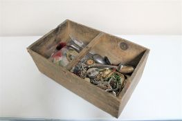 A wooden crate of costume jewellery, bangles,
