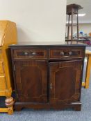 An inlaid mahogany side cabinet