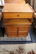 A Nathan teak telephone stand fitted with a drawer