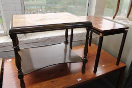 A tiled topped coffee table and a copper topped table.