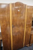 A walnut wardrobe and dressing table