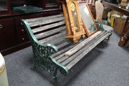 A metal ended wooden slatted garden bench