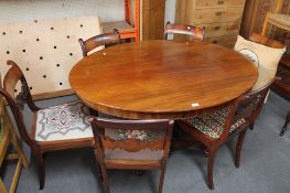 A 19th century mahogany oval pedestal table.