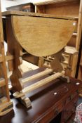A light oak drop leaf table
