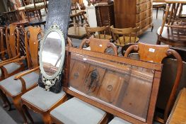A mid century mirror, an oval mirror and a small metal screen.