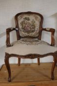 A 19th century style carved walnut armchair.