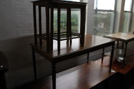 A nest of tables and a mahogany coffee table