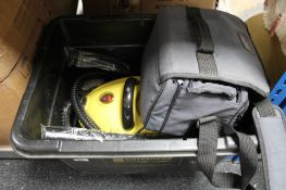 A box of steam cleaner and an Orion video camera