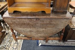An early twentieth century oak gateleg table