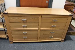 A light beech eight drawer chest