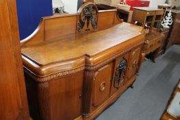 An early 20th century oak break-fronted sideboard.