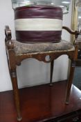 An Edwardian piano stool and leatherette footstool