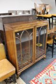An early twentieth century mahogany display cabinet