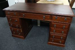 An Edwardian mahogany pedestal desk