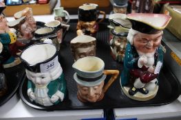 A tray of twelve ceramic character jugs (12)