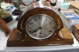 An inlaid mahogany mantel clock