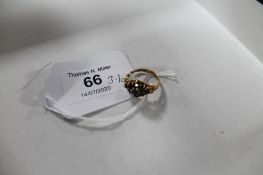 A 9ct gold dress ring set with blue stones, size N CONDITION REPORT: 3.