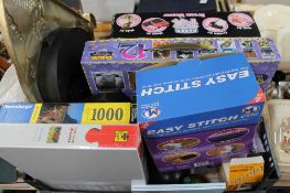 A box of jigsaw puzzles, decorative clock,