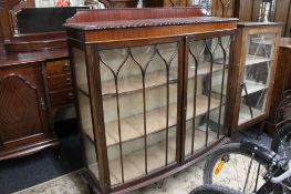 An Edwardian mahogany bow fronted display cabinet