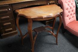 An Edwardian mahogany occasional table