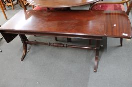 A reproduction mahogany coffee table
