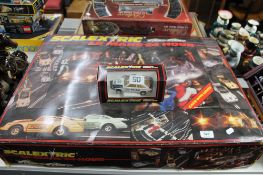 A Scalextric 24 hour box set with further racing car