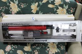 A boxed Tasco telescope