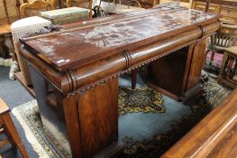 A nineteenth century mahogany pedestal sideboard