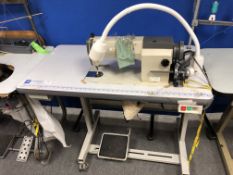 A Korean KM-235A industrial electric flat sewing machine in table