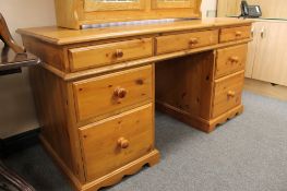 A pine pedestal desk