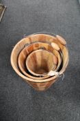 A graduated set of metal bound wooden buckets