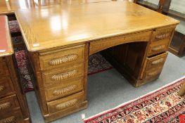 A Victorian carved oak pedestal desk, width 153 cm.